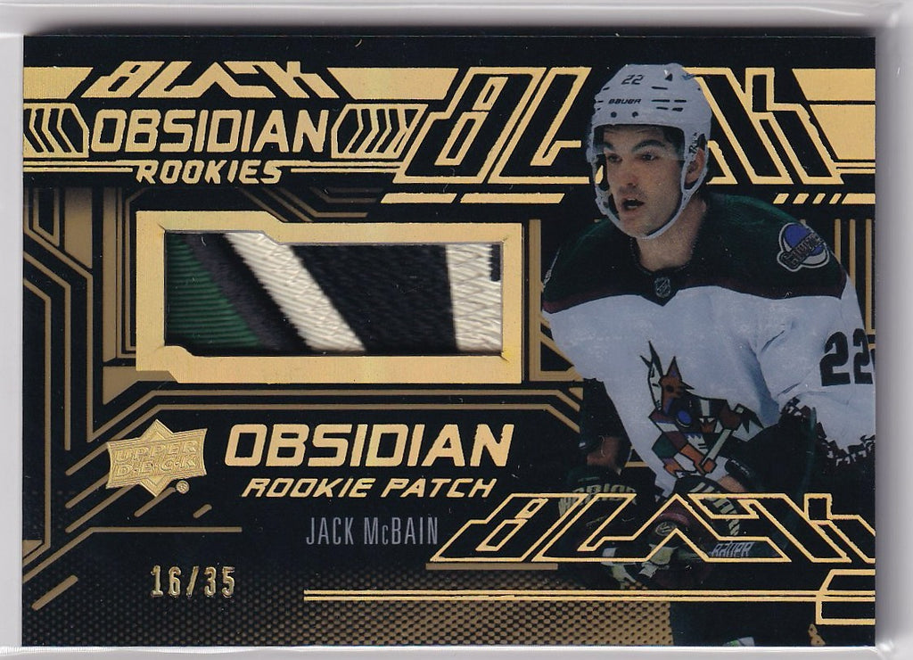 2022-23 SPx Hockey UD Black Obsidian Rookies Jersey Gold Patch #/35 #ORJ-JM Arizona Coyotes, Jack McBain
